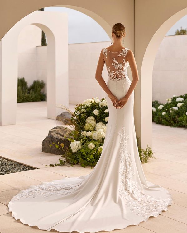 NERITA - Mermaid silhouette wedding dress with deep neckline and straps. Illusion back with skirt in stretch crepe and bead... 1