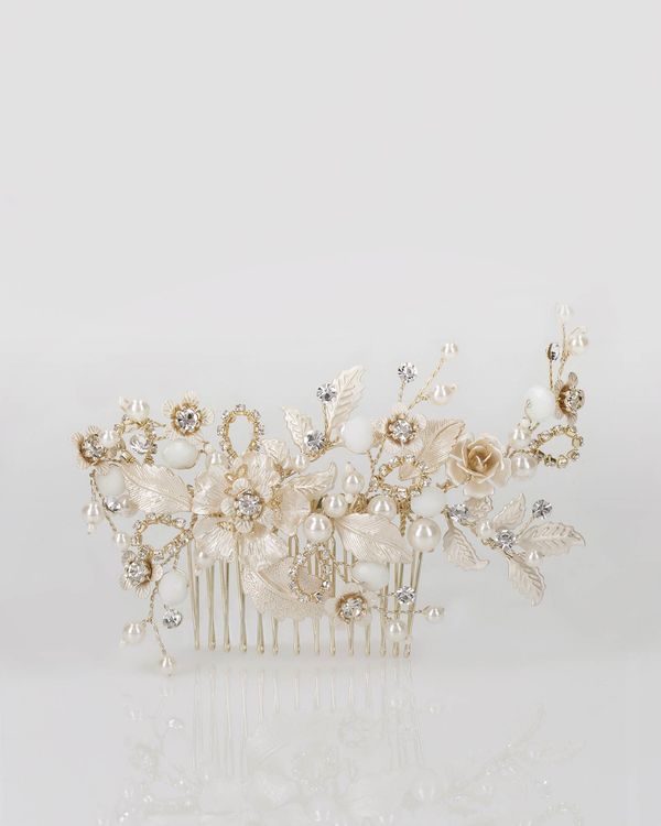 7LT35PEIN0P - Romantic style bridal comb, with floral and leaves motifs made of rhinestones and pearls. 1
